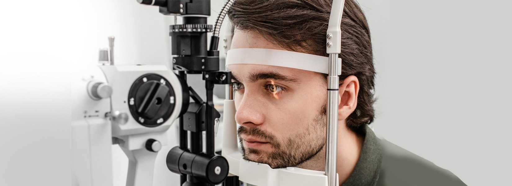 young man during eye exam in Greensburg Downtown Historic District